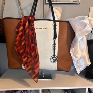 18x12 Michael Kors tote brown, and cream with black leather handles and trim